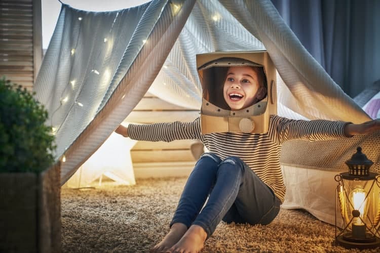 kid playing in tent