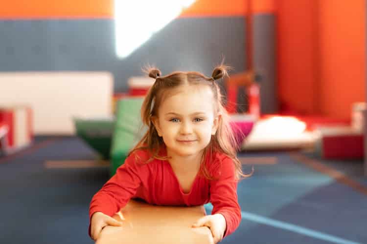 active child girl in sensory integration room,kindergarten. Kid is active leisure.