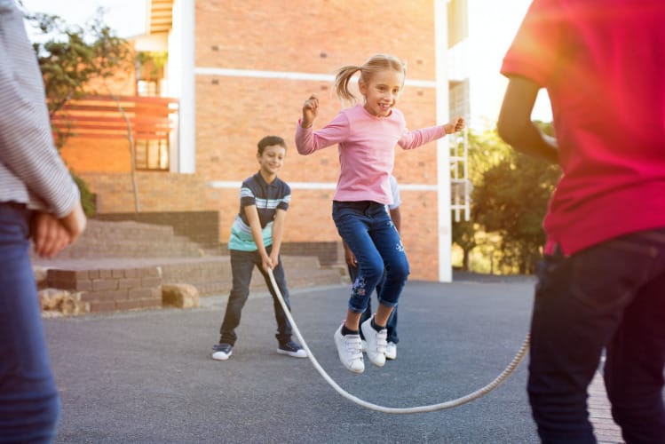 Children playing with skipping rope