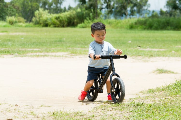 Small kid riding a bike